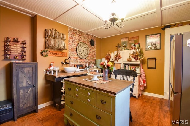 120 E Corbin St, Bethalto, IL 62010 - kitchen featuring freestanding refrigerator, green cabinetry, wood counters, dark wood-style floors, and baseboards