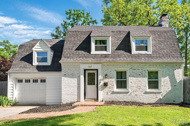 517 Mclain Ln, Saint Louis, MO 63122 - view of front of home with a chimney, a shingled roof, driveway, and brick siding