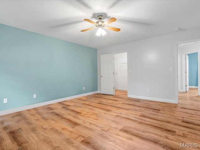 927 Annabrook Park Dr, Ofallon, MO 63366 - unfurnished room featuring light wood-type flooring, ceiling fan, and baseboards