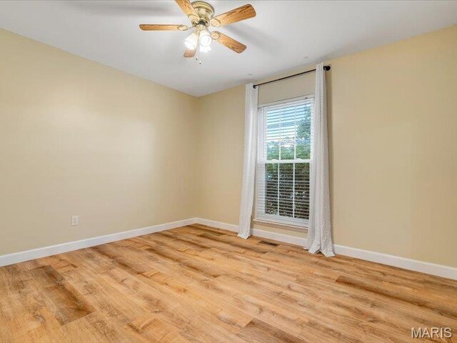 927 Annabrook Park Dr, Ofallon, MO 63366 - spare room with baseboards, wood finished floors, and ceiling fan