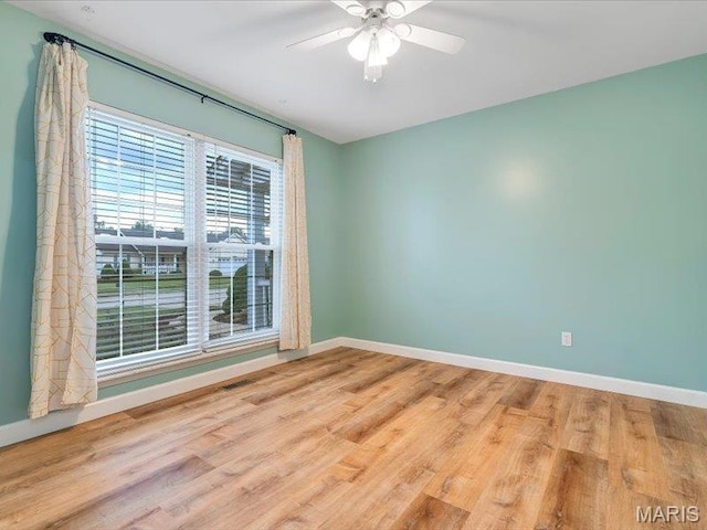 927 Annabrook Park Dr, Ofallon, MO 63366 - empty room with baseboards, a ceiling fan, and wood finished floors