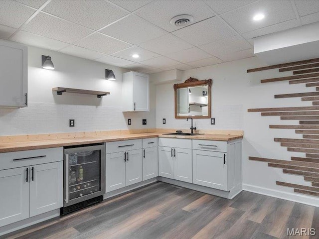 927 Annabrook Park Dr, Ofallon, MO 63366 - kitchen with wine cooler, wood counters, a sink, dark wood finished floors, and open shelves