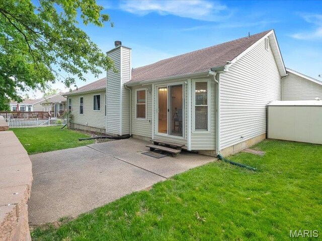 927 Annabrook Park Dr, Ofallon, MO 63366 - back of property featuring a chimney, a patio area, and entry steps