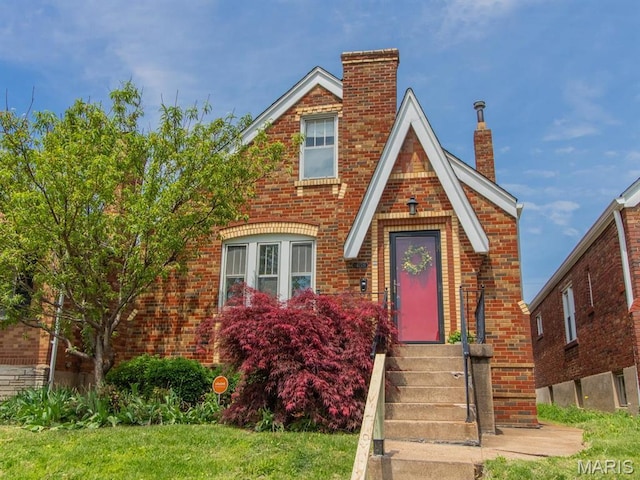 4151 Tholozan Ave, Saint Louis, MO 63116 - english style home with a chimney and brick siding