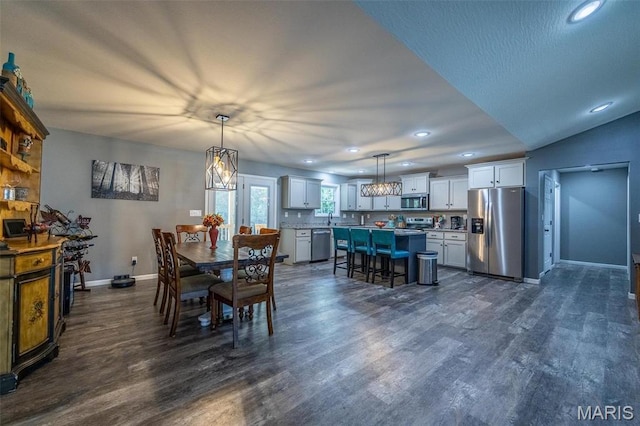 1541 Fairfield Dr, Lebanon, MO 65536 - dining room with baseboards, dark wood-type flooring, recessed lighting, and a chandelier