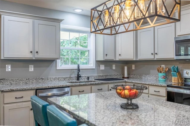 1541 Fairfield Dr, Lebanon, MO 65536 - kitchen featuring appliances with stainless steel finishes, a sink, light stone counters, and recessed lighting