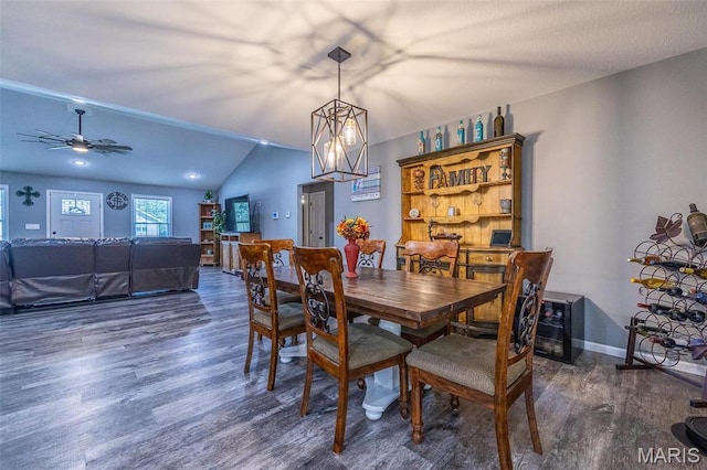 1541 Fairfield Dr, Lebanon, MO 65536 - dining room with dark wood-style flooring, a ceiling fan, vaulted ceiling, and baseboards