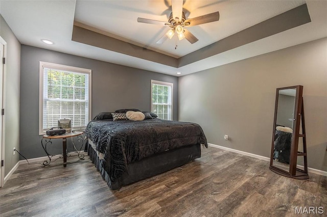 1541 Fairfield Dr, Lebanon, MO 65536 - bedroom with a tray ceiling, baseboards, wood finished floors, multiple windows, and recessed lighting