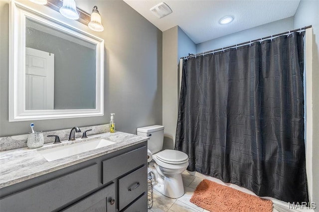 1541 Fairfield Dr, Lebanon, MO 65536 - bathroom featuring tile patterned floors, toilet, vanity, and curtained shower