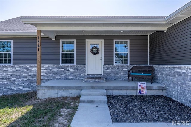 1541 Fairfield Dr, Lebanon, MO 65536 - doorway to property with covered porch and roof with shingles