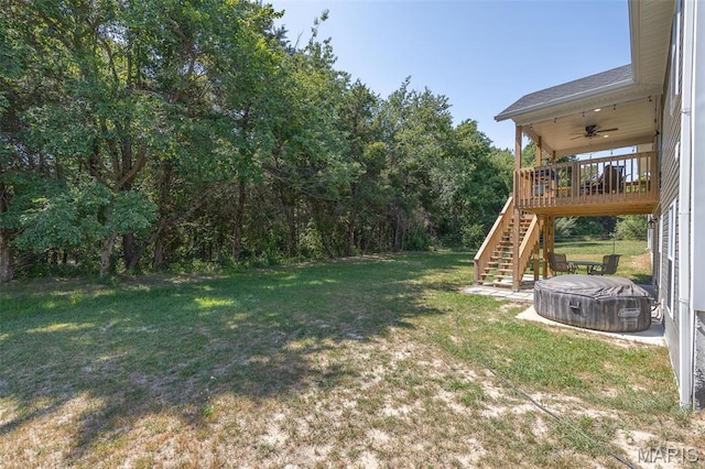 1541 Fairfield Dr, Lebanon, MO 65536 - view of grassy yard with ceiling fan and stairs