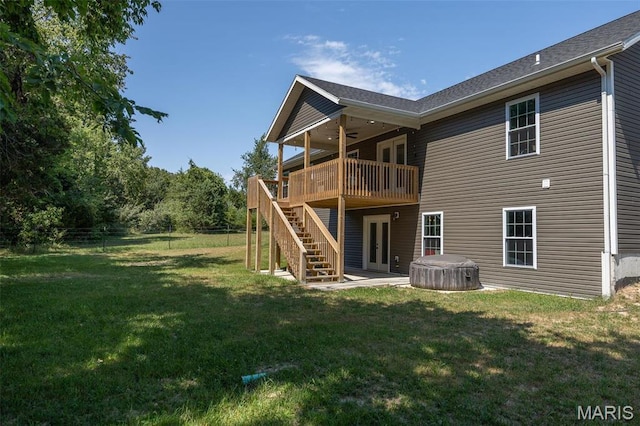 1541 Fairfield Dr, Lebanon, MO 65536 - rear view of house with french doors, a hot tub, a wooden deck, stairway, and ceiling fan