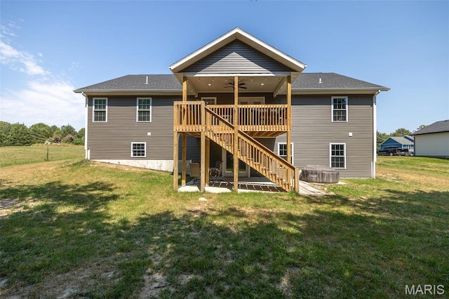 1541 Fairfield Dr, Lebanon, MO 65536 - back of property with a ceiling fan, stairway, a wooden deck, and a lawn