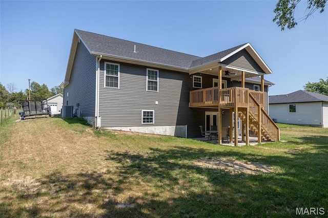 1541 Fairfield Dr, Lebanon, MO 65536 - rear view of property with ceiling fan, a deck, stairway, and a lawn