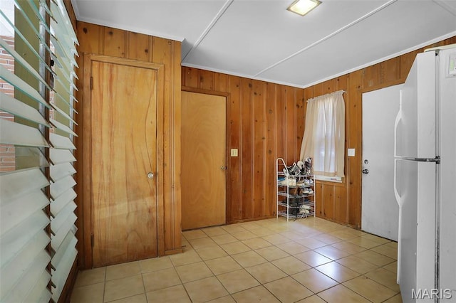 11 Wilshire St, East Alton, IL 62024 - foyer entrance with wooden walls, light tile patterned floors, and crown molding