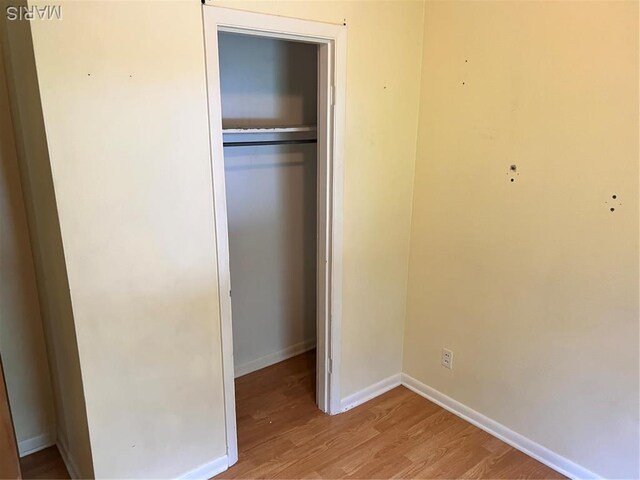 5007 Seiler Rd, Dorsey, IL 62021 - unfurnished bedroom with wood finished floors, a closet, and baseboards