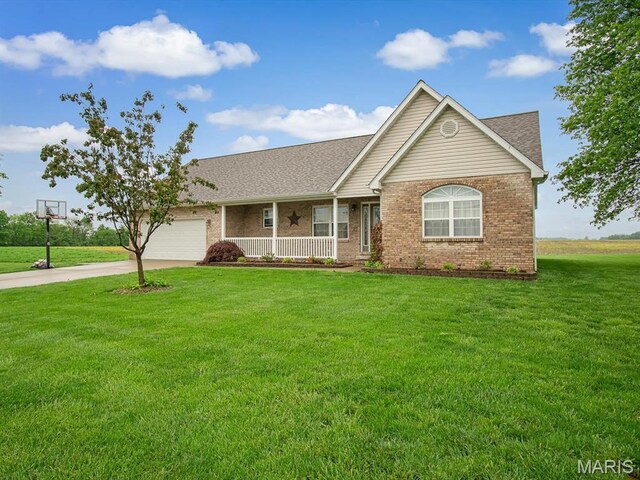 view of front of home with a porch, brick siding, driveway, a garage, and a front yard