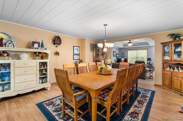 16785 County Road 624, Dexter, MO 63841 - dining space featuring light wood-type flooring, a chandelier, ornamental molding, and a ceiling fan