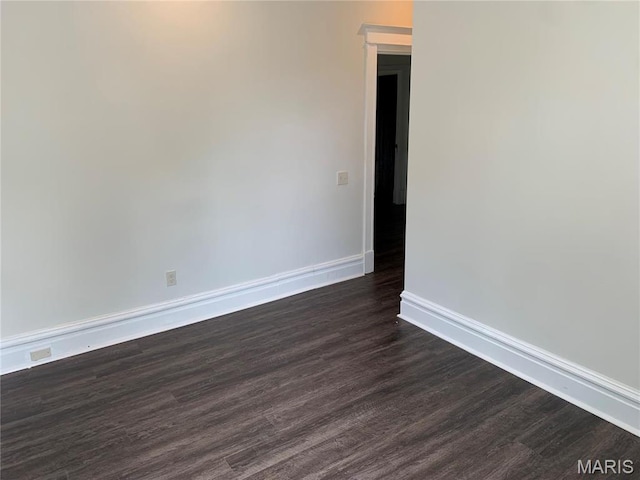 3616 Osceola St, Saint Louis, MO 63116 - unfurnished room featuring baseboards and dark wood-style floors