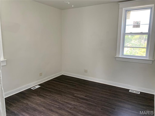 3616 Osceola St, Saint Louis, MO 63116 - spare room featuring dark wood finished floors and baseboards