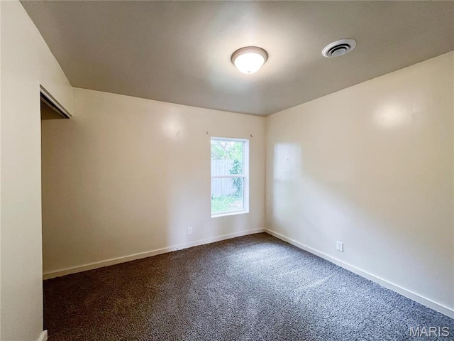 230 S Church St, Sullivan, MO 63080 - spare room with dark colored carpet and baseboards