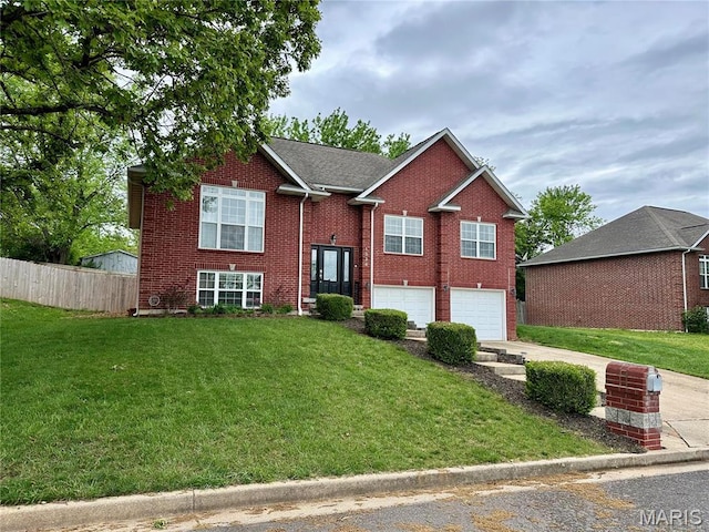 1324 Chelsea Ln, Rolla, MO 65401 - split foyer home featuring driveway, a garage, and brick siding