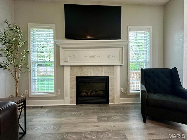 1324 Chelsea Ln, Rolla, MO 65401 - sitting room featuring wood finished floors, baseboards, and a tile fireplace