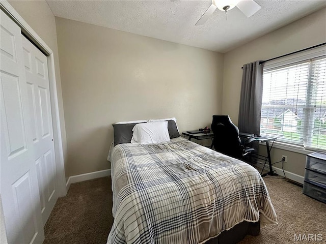1324 Chelsea Ln, Rolla, MO 65401 - bedroom featuring carpet floors, baseboards, a closet, a textured ceiling, and a ceiling fan