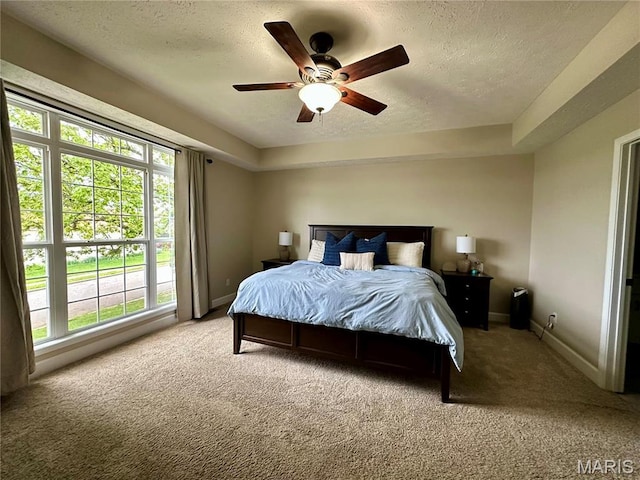 1324 Chelsea Ln, Rolla, MO 65401 - carpeted bedroom with a textured ceiling, baseboards, and a ceiling fan