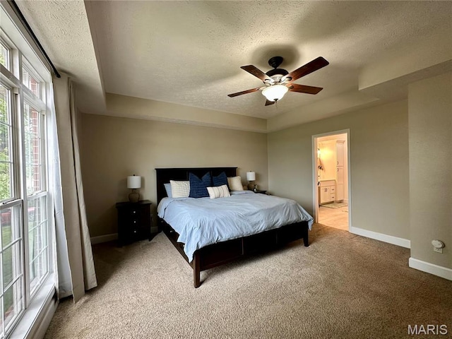 1324 Chelsea Ln, Rolla, MO 65401 - bedroom with a textured ceiling, light colored carpet, baseboards, connected bathroom, and a ceiling fan