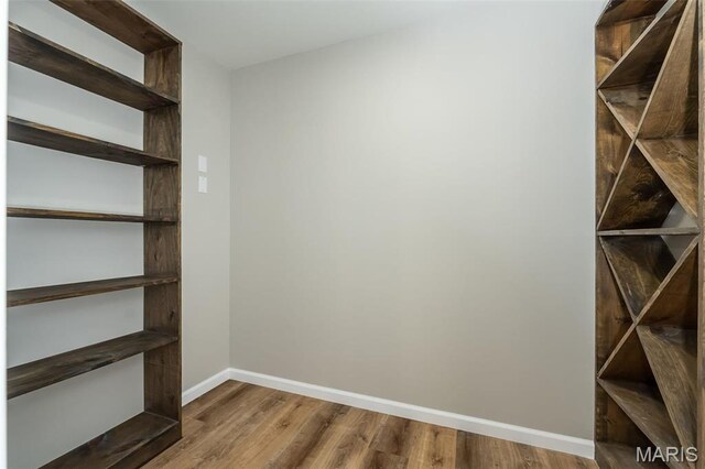 1300 Forest Creek Dr Unit 1, Saint Charles, MO 63303 - walk in closet featuring wood finished floors
