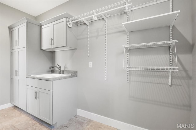 spacious closet with a sink