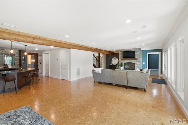 living area with baseboards, a fireplace, recessed lighting, and stairs