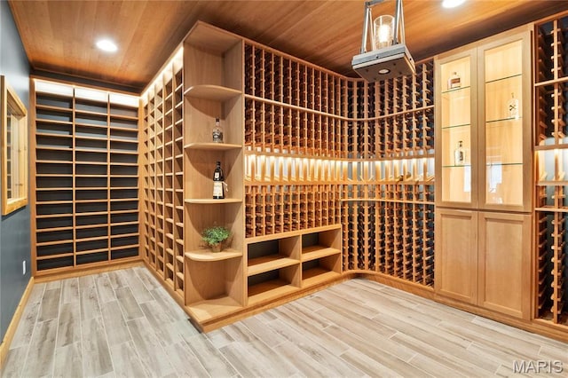 wine area featuring wood ceiling, light wood-type flooring, and recessed lighting