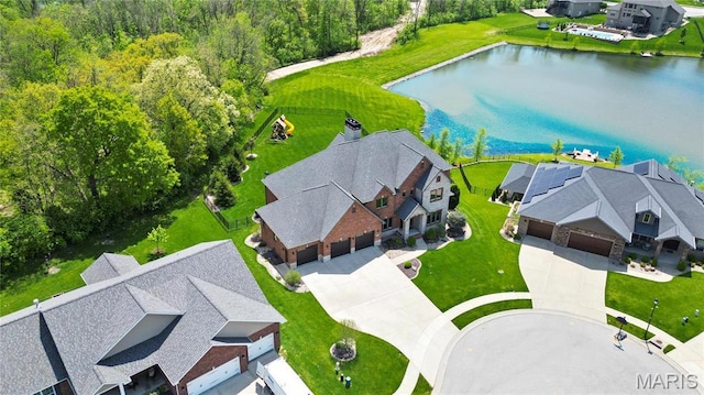 aerial perspective of suburban area with a large body of water