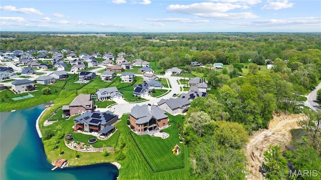 bird's eye view of a large body of water and a heavily wooded area