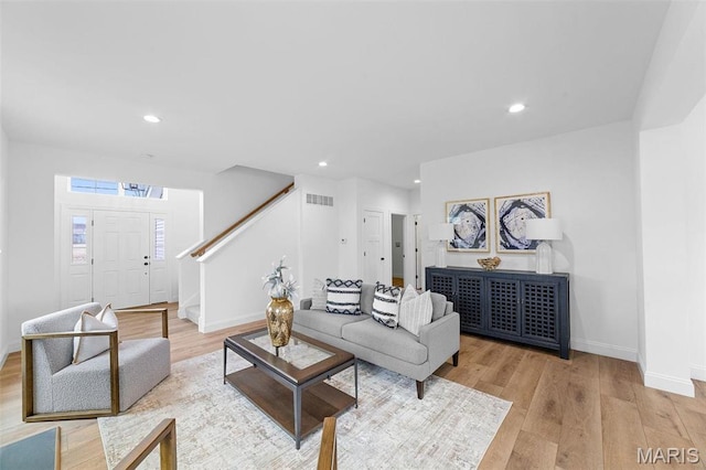 119 Monica Dr, Sunset Hills, MO 63127 - living room featuring stairs, light wood-style flooring, baseboards, and recessed lighting