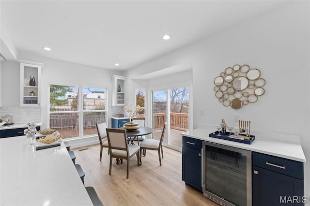 119 Monica Dr, Sunset Hills, MO 63127 - dining space with beverage cooler, plenty of natural light, light wood-style flooring, and recessed lighting