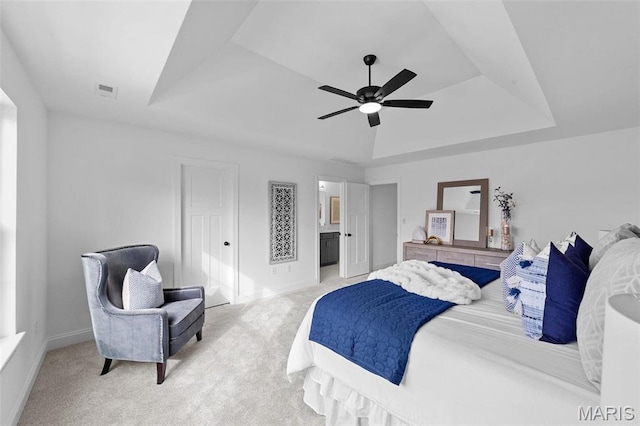 119 Monica Dr, Sunset Hills, MO 63127 - bedroom featuring a tray ceiling, light carpet, baseboards, ceiling fan, and connected bathroom