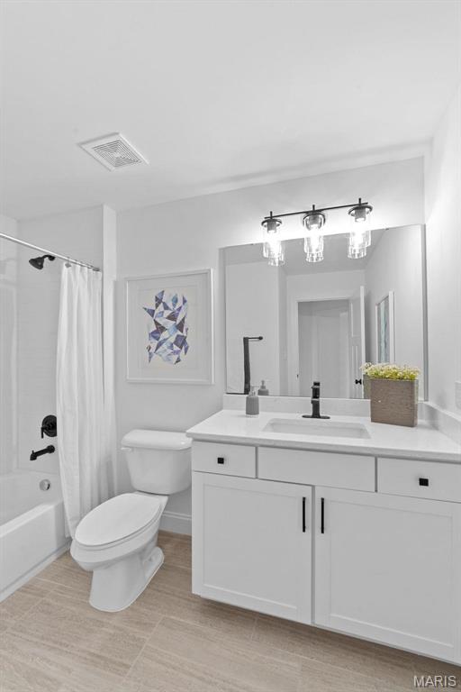 119 Monica Dr, Sunset Hills, MO 63127 - bathroom featuring toilet, vanity, and shower / tub combo