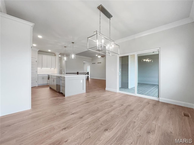 130 Stone Canyon Blvd, Foristell, MO 63348 - kitchen with dishwasher, open floor plan, light countertops, ornamental molding, and a center island with sink