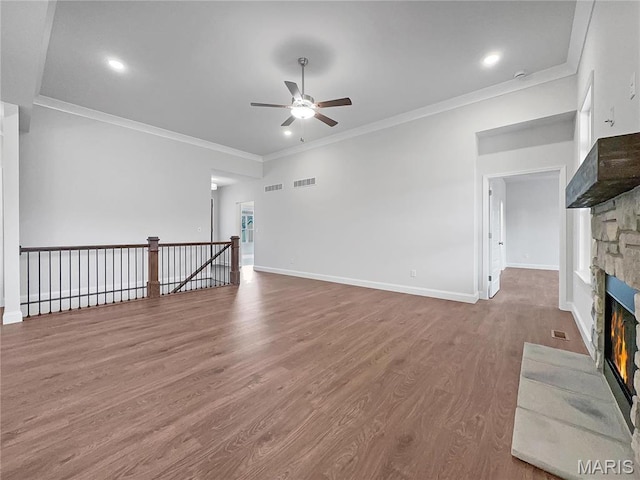 130 Stone Canyon Blvd, Foristell, MO 63348 - unfurnished living room with ceiling fan, a stone fireplace, wood finished floors, crown molding, and baseboards
