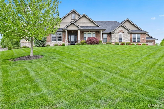 132 Hillary Cir, Wentzville, MO 63385 - craftsman inspired home with a front lawn, roof with shingles, and brick siding
