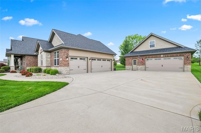 132 Hillary Cir, Wentzville, MO 63385 - craftsman inspired home with stone siding, a front yard, concrete driveway, and a shingled roof