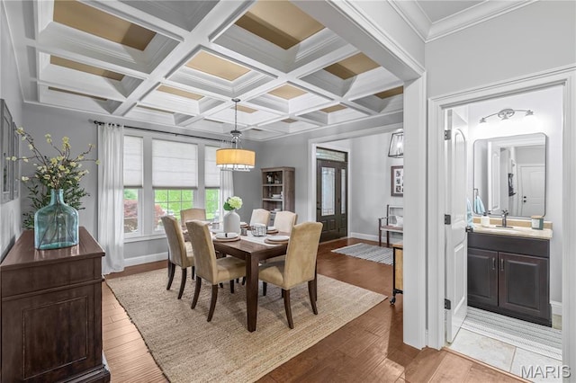 132 Hillary Cir, Wentzville, MO 63385 - dining area with light wood-style floors, baseboards, beamed ceiling, coffered ceiling, and ornamental molding