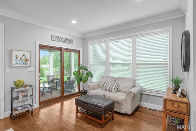 132 Hillary Cir, Wentzville, MO 63385 - living area with ornamental molding, wood finished floors, baseboards, and recessed lighting