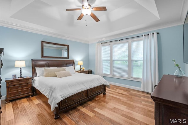 132 Hillary Cir, Wentzville, MO 63385 - bedroom with a tray ceiling, light wood-style floors, baseboards, ornamental molding, and a ceiling fan