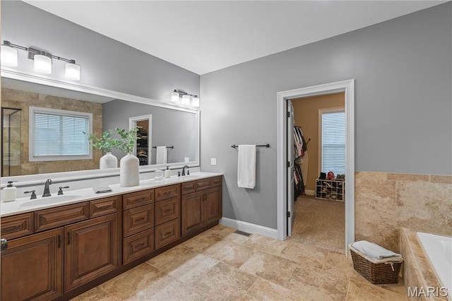 132 Hillary Cir, Wentzville, MO 63385 - bathroom with a garden tub, double vanity, and a shower