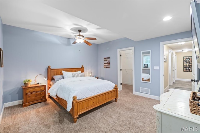 132 Hillary Cir, Wentzville, MO 63385 - bedroom featuring baseboards, a spacious closet, ceiling fan, light carpet, and recessed lighting
