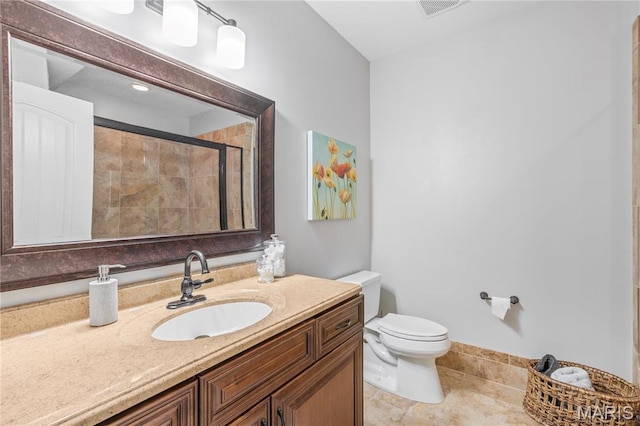 132 Hillary Cir, Wentzville, MO 63385 - bathroom featuring a stall shower, toilet, vanity, and tile patterned flooring